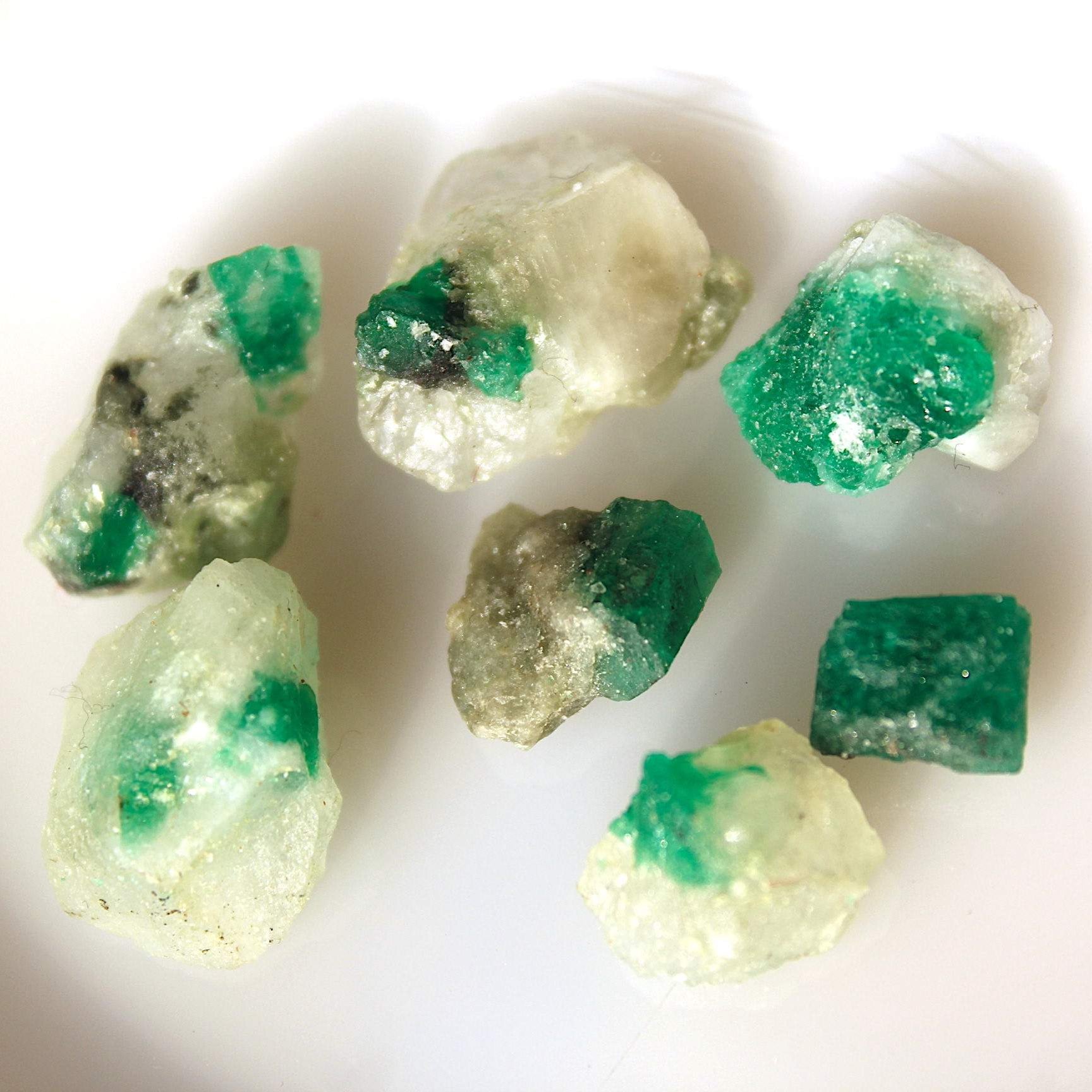 Raw Emerald specimens on Calcite