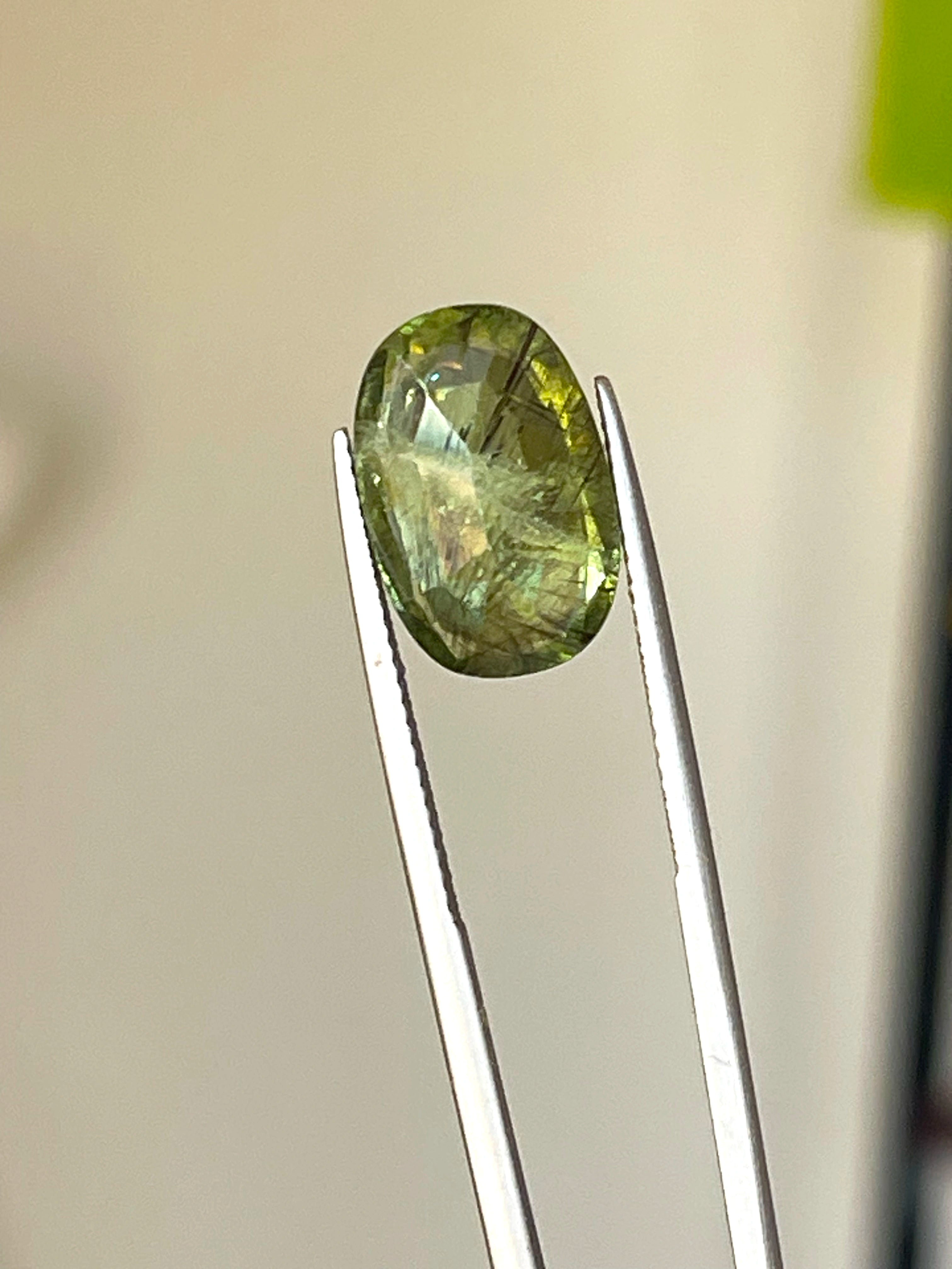 Sterling silver pendant featuring unique Ludwigite Peridot stone