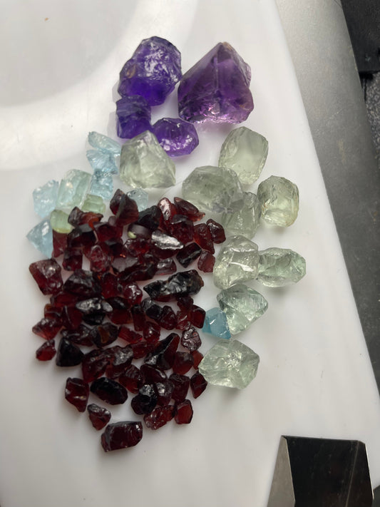 Mixed parcel of Raw Facet Grade Stones