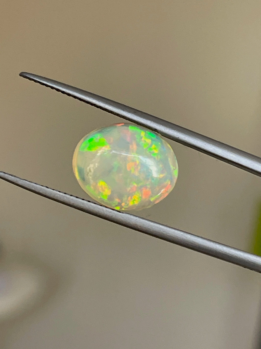 Oval Cut Ethiopian Opal 3.6 carats displaying unique color flashes and gemstone clarity