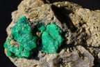 Green Emerald mineral specimen featuring bright green crystal clusters 
