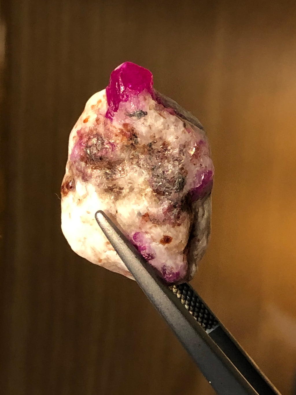 Explore Ruby hexagonal crystal inclusions