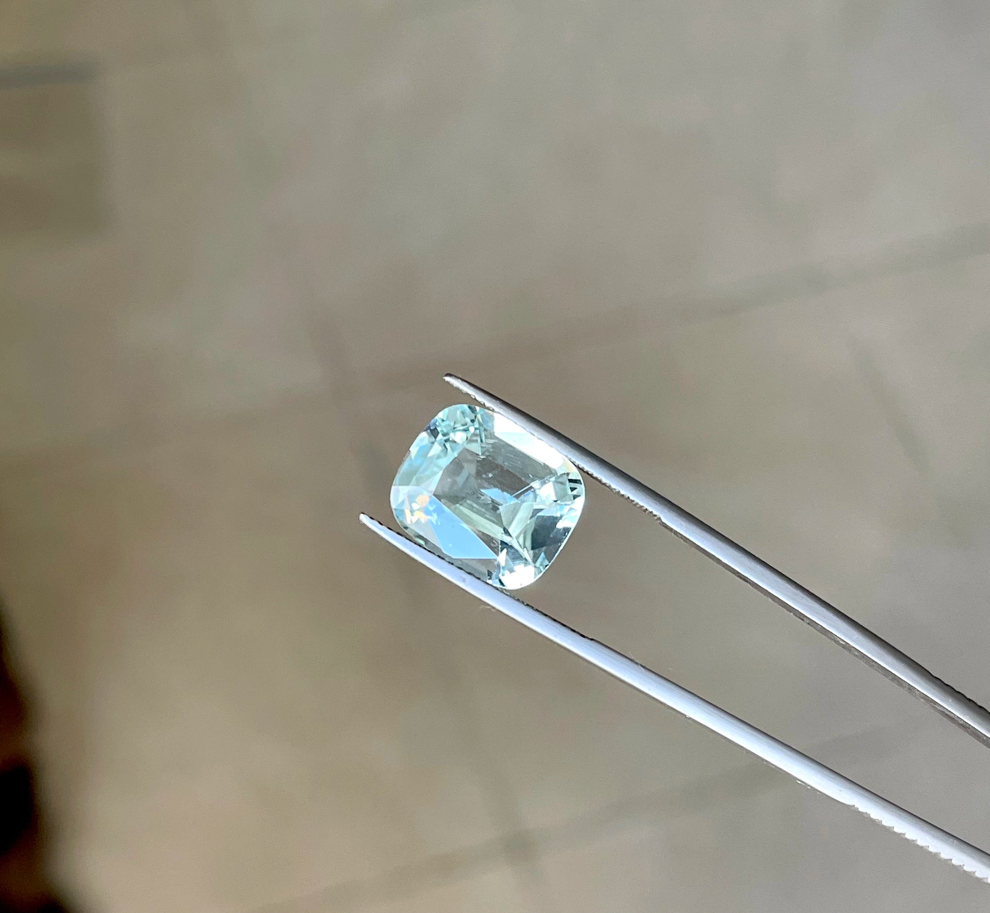 Cushion Cut Blue Aquamarine Loose Stone 7.9 carats displaying facets and light reflection