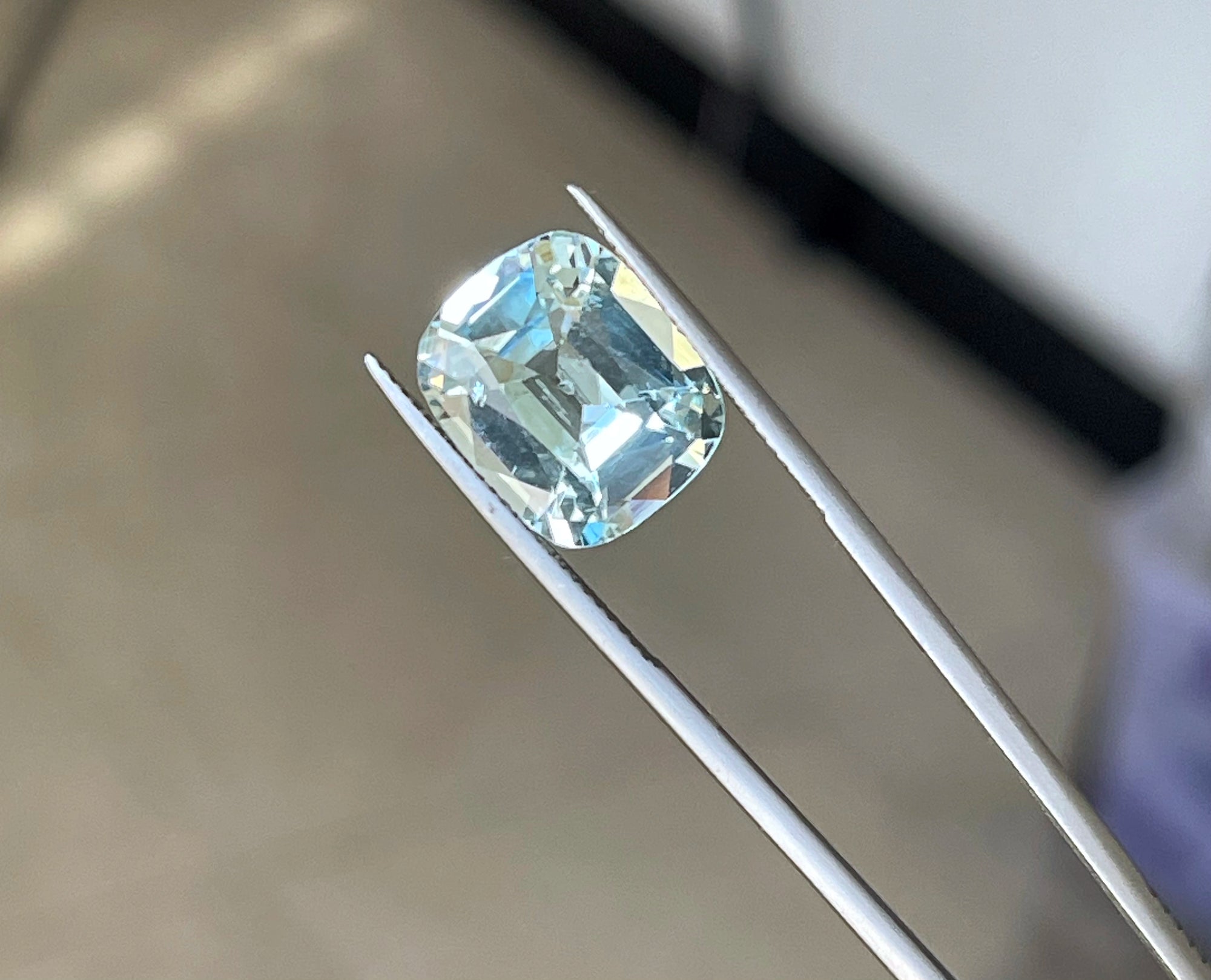 7.9 carats Blue Aquamarine Loose Gemstone with Emerald Cut showing brilliant color and clarity