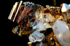 A close-up of a mineral specimen featuring metallic gold