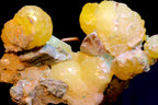 A close-up of a brucite mineral specimen on matrix