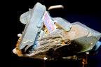 A close-up of a mineral specimen Chlorite Quartz with Brookite on Matrix 