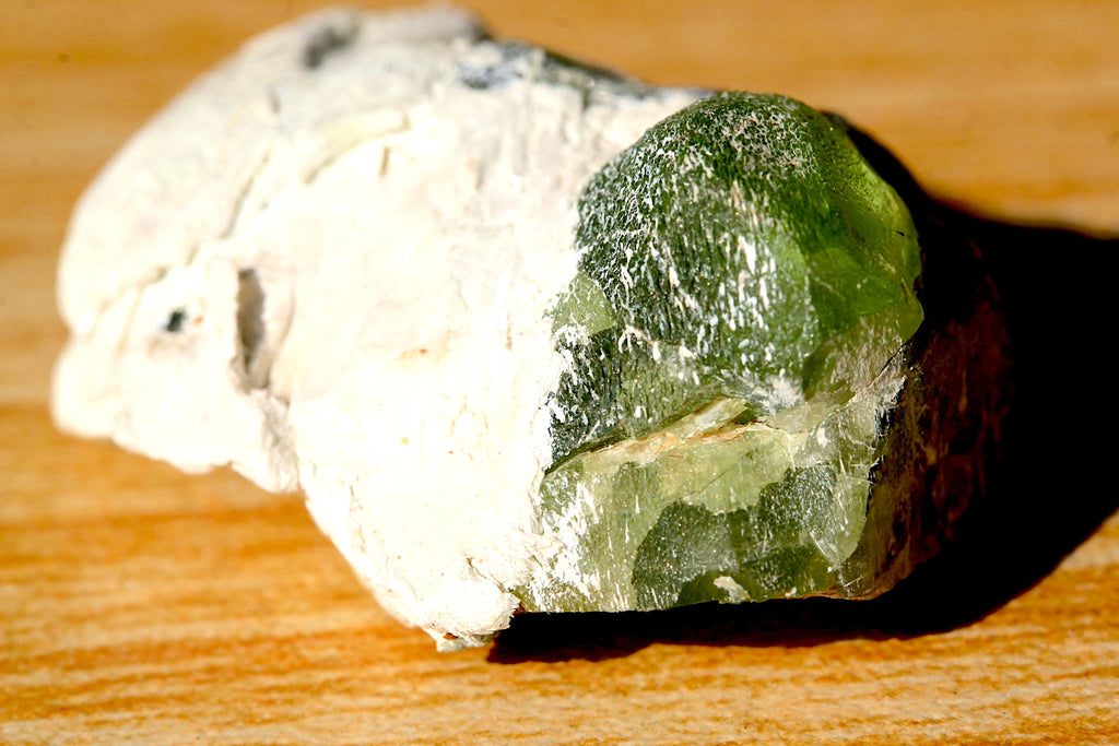 peridot on white marble