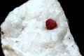 Red spinel specimen on matrix rock