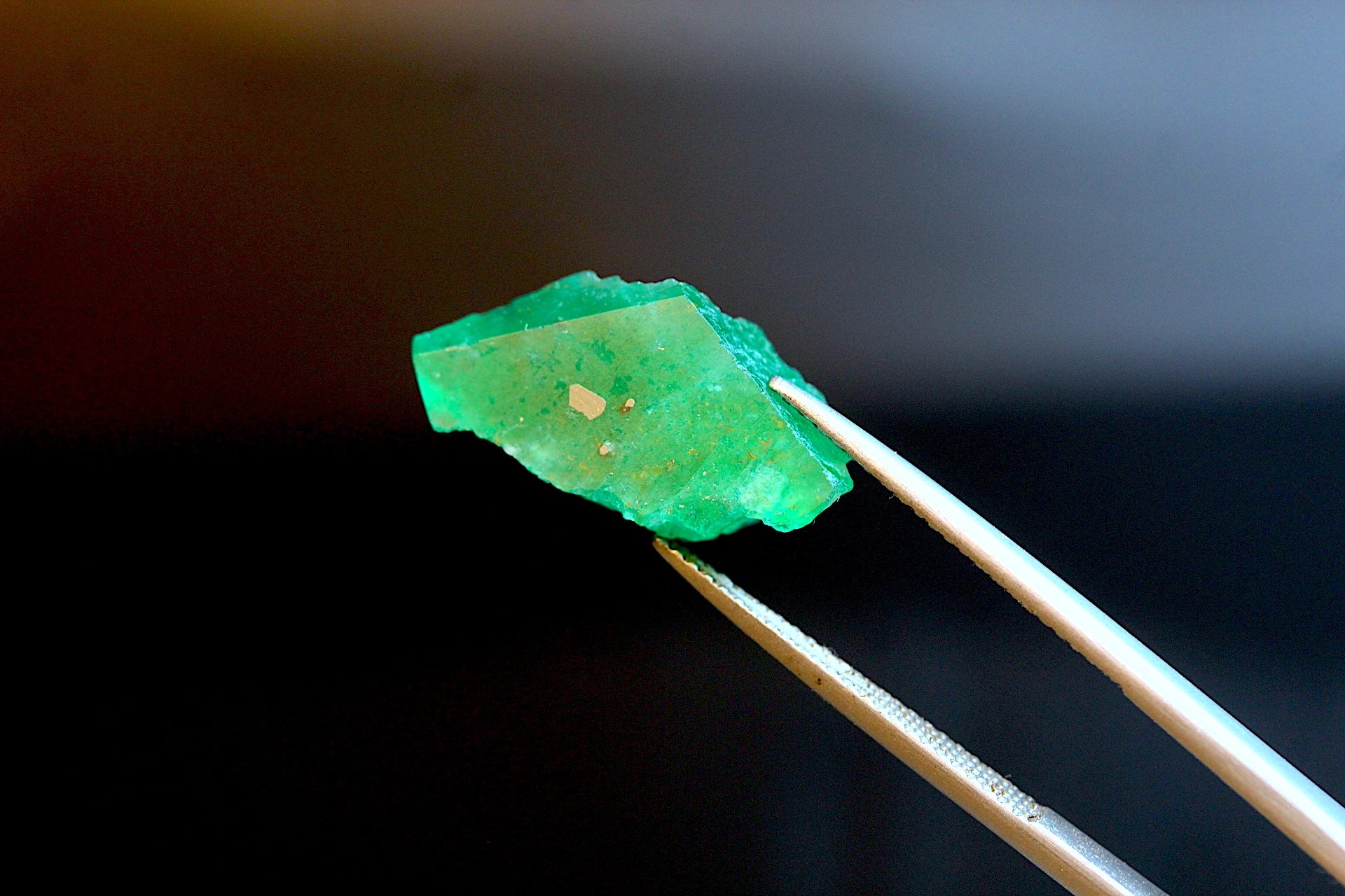 11.99 carats Uncut Swat Emerald with Pyrite Inclusions — Pakistan